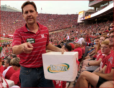 Ben Sasse sells Runzas at a Cornhuskers game.