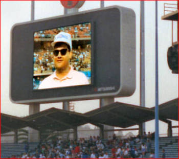 PyroManiac (sans beard) on Dodger Diamondvision. Note fearless display of Chicago Cubs' hat.